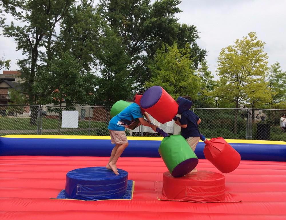 Two young children having fun on an inflatable